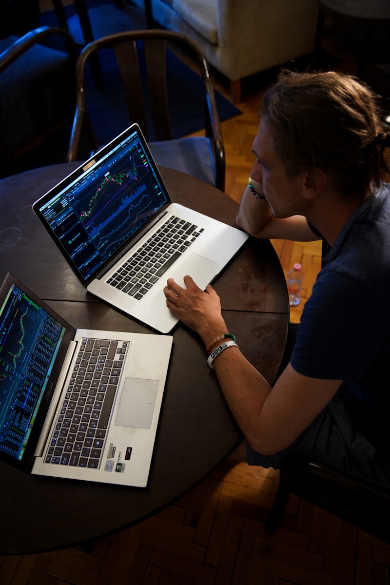 Data Fabric: Understanding the Future of Data Management man sitting in front of the MacBook Pro